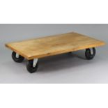 A TERENCE CONRAN ‘ROLLER’ LOW COFFEE TABLE, with golden oak rectangular top, & on four 8”