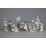 A Lladro Daisa porcelain ornament in the form of a kneeling oriental female figure tending a vase of