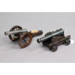 Two 18th century-style miniature model cannon, 9” & 7” long.