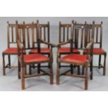 A set of six oak rail-back dining chairs (including a pair of carvers, each with a padded drop-in-