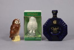 A Royal Doulton novelty ceramic “Snowy Owl” bottle of Whyte & Mackay Scotch Whisky, with contents,