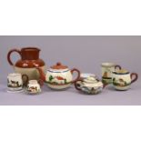 Six items of Torquay Pottery Motto ware, a Lovatt’s pottery jug, 7½” high; & a Japanese teacup &