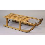 A vintage Gray’s of Cambridge “Davos” wooden sledge, 37” long.