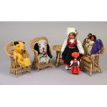 Two hand puppets- Sooty and Sweep, five various dolls, and a dolls wicker four-piece lounge suite.