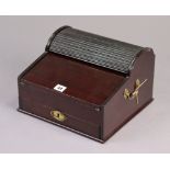 A late 19th/early 20th century mahogany sloping-front writing box enclosed by a tambour-shutter &