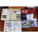 A collection of GB & foreign stamps, GB First Day Covers, cigar cards, etc., in four albums & loose;