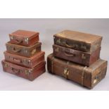 A vintage fibre-covered travelling trunk with a hinged lift-lid, 33” wide; & six various vintage