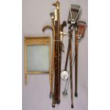 Two aluminium shooting sticks; nine various walking canes; & a washboard.