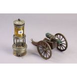 A brass & steel minor’s lamp, 9¾” high; & a model canon, 10” long