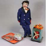 A painted papier mache ventriloquist’s dummy, 31½” tall. with various accessories.
