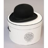 A Lock & co of London black felt bowler hat (size 7?”), with hat box.