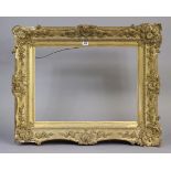 A 19th Century gilt-gesso rectangular picture frame with a raised foliate border 23” x 17” (internal