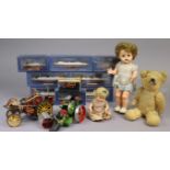 A golden plush teddy bear, 14” tall (worn); together with two celluloid dolls; eight model boats,