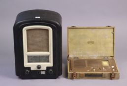 A vintage Ferranti valve radio in a brown Bakelite case having a domed top (lacking backboard); &