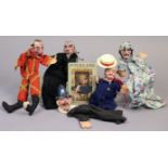 Four mid-20th Century painted composition Punch & Judy puppets; & one volume “Punch & Judy” edited