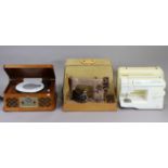 Two singer electric sewing machines, each with case, & a Zennox modern music system.