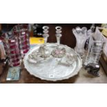 An engraved silver-plated tray, 16” diameter, a pair of plated candlesticks, 9” high, four glass