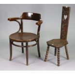 A Thonet Bentwood elbow café chair with a circular seat, & on round tapered legs with