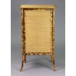 A bamboo and woven-cane upright cupboard fitted two shelves enclosed by a door, 20½” wide x 36”