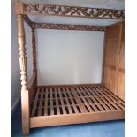 A continental-style pine tester bed with carved footboard & side-rails. 67 inches wide X 88.75 inch