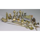 A pair of brass fire-dogs, 12” high; a set of three brass fire-implements; & various items of