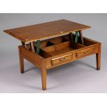 A cherrywood large low coffee table with a rise and fall rectangular top, & on four short square