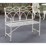 A white-finish wrought-iron two seater garden bench, 40” long.