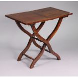 A reproduction mahogany coaching table with a rectangular folding top, and on four shaped legs