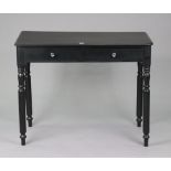 A black painted pine side table fitted two frieze drawers, & on turned legs, 35½” wide x 28” high.