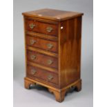 A small yew wood chest fitted four long drawers with brass swing handles, & on bracket feet, 17¼”