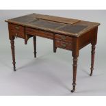 An Edwardian mahogany knee-hole writing desk inset leather to the sliding top, fitted with an