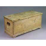 A vintage deal blanket box with hinged/removable lift-lid, having iron side handles, and on a shaped