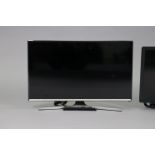 A Samsung 31” colour television; & an LG 26” ditto, each with remote control.