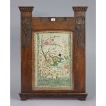 An early 20th century carved oak-frame firescreen inset embroidered floral panel, 24¾” wide 33¾”