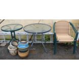 A green painted aluminium patio table inset glass top, & on four shaped legs, 23¾” diameter x 28”