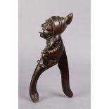 A pair of Victorian treen nutcrackers carved in the form of an imp, the front handle in the form