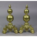 A pair of Victorian large brass andirons, with flame finials on bulbous supports, claw-&-ball