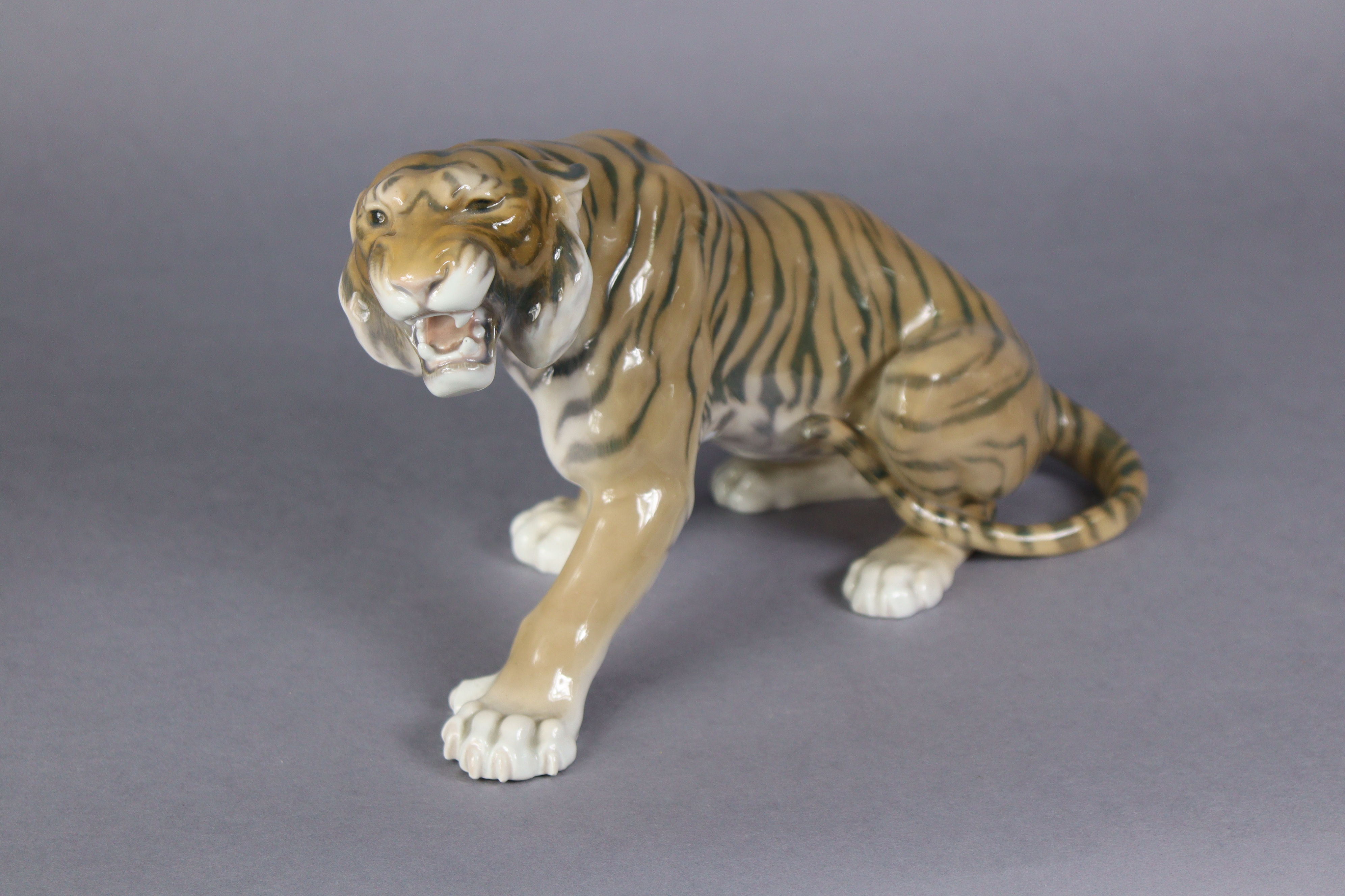 A Bing & Grondahl porcelain model of a tiger, No. 1712 by Lauritz Jensen, 11” long x 7” high. (hairl - Image 2 of 4