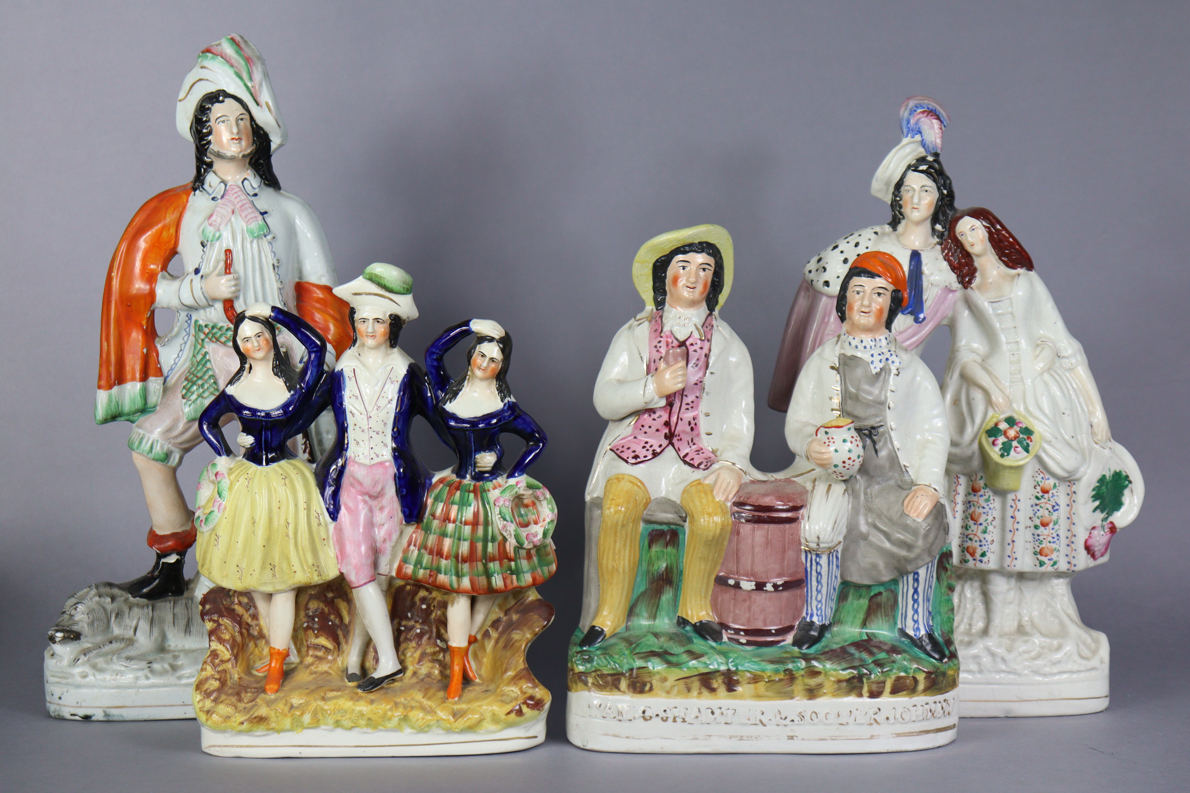 A 19th century Staffordshire pottery flat-back figure group “Tam-O-Shanter & Sooter Johnny”, 13”