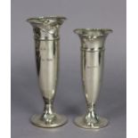 A George V silver trumpet-shaped spill vase of tapering form with loaded round pedestal foot,