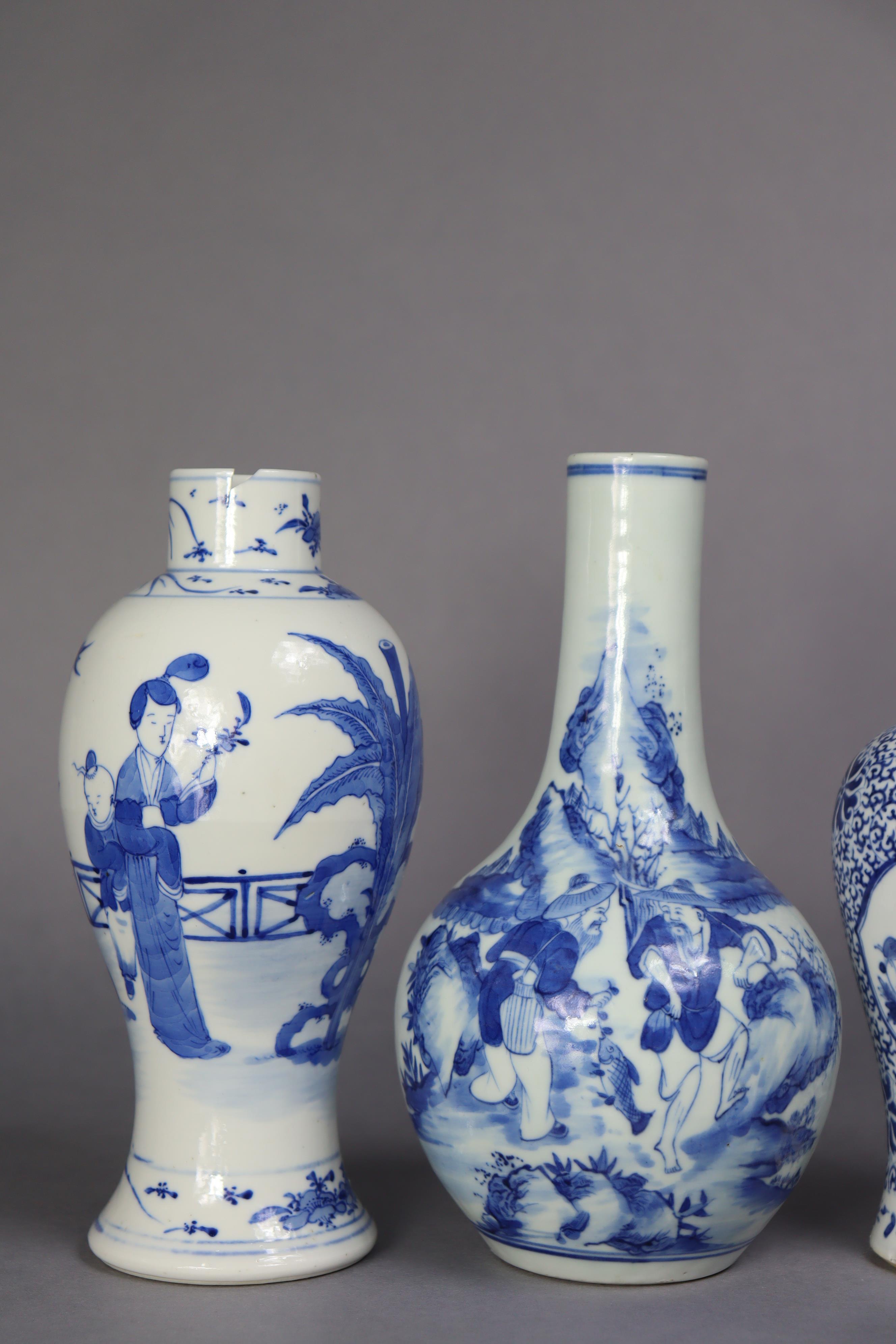 A 19th century Chinese blue & white porcelain bottle vase decorated with fishermen in a - Image 2 of 8