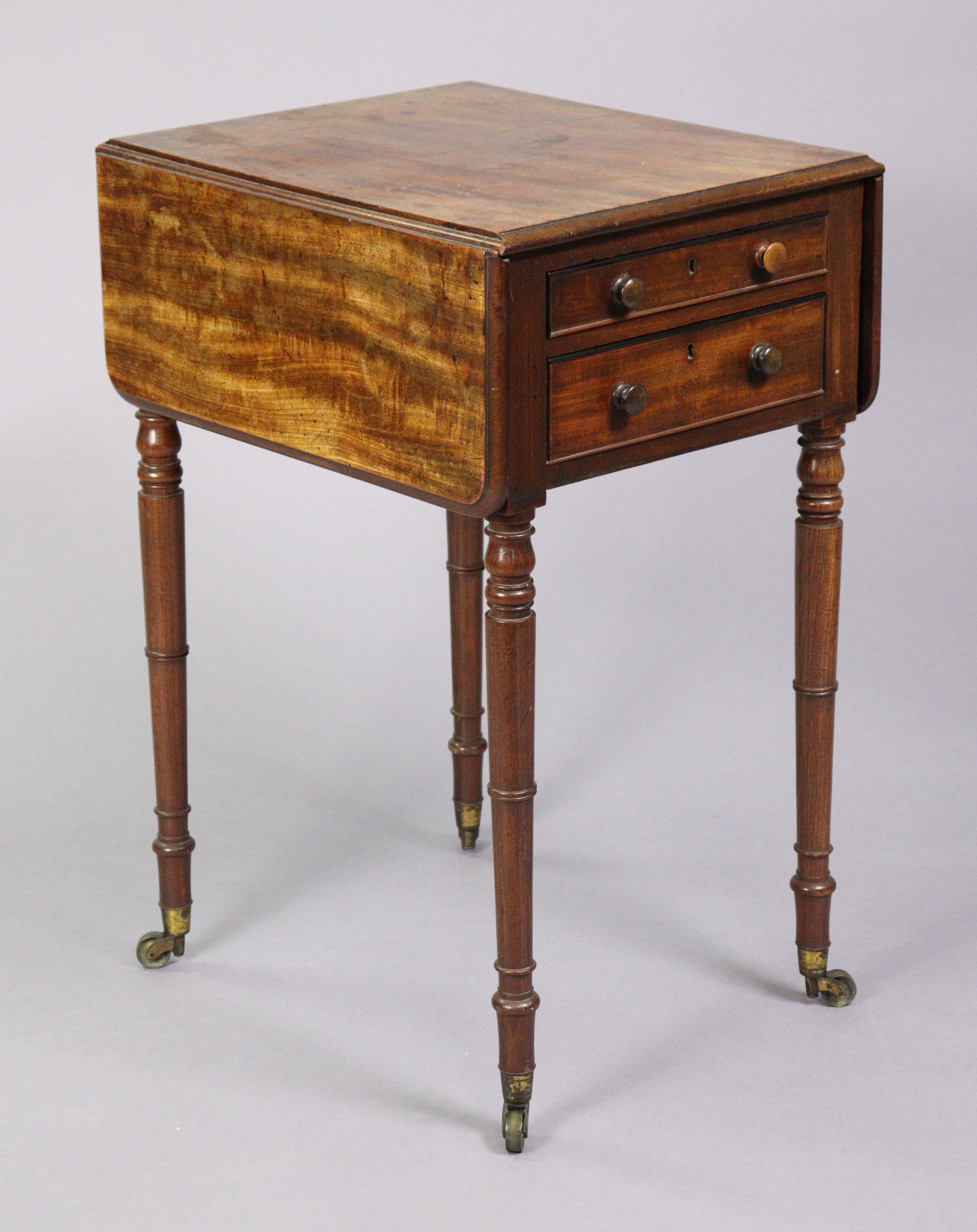 An early 19th century mahogany drop-leaf work table, fitted two frieze drawers to one end with