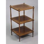 A mahogany small rectangular three-tier whatnot on turned supports with bun finials, 15” square x