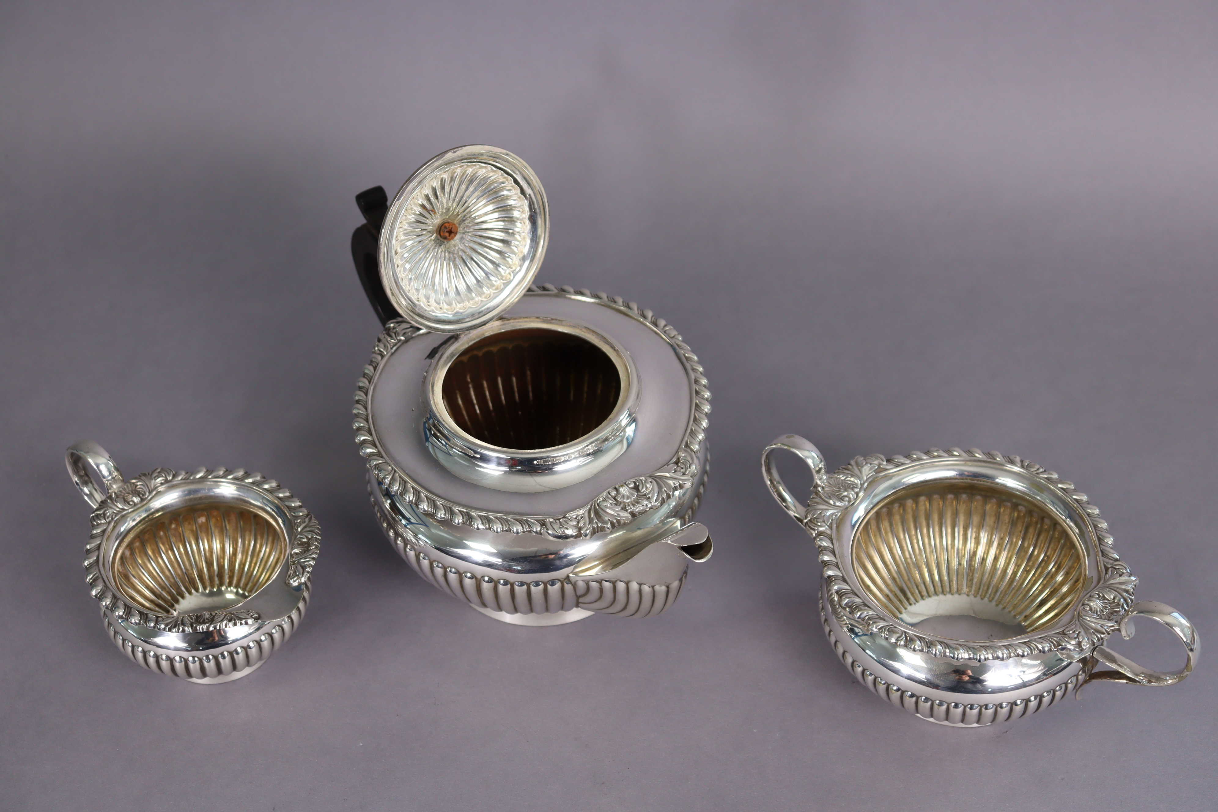 A silver-plated regency-style three-piece tea service of squat round semi-fluted form, with - Image 2 of 3