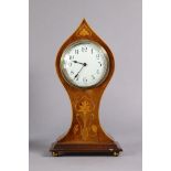 An Edwardian inlaid mahogany mantel timepiece in art-nouveau-style balloon-shaped case, the 3¼”
