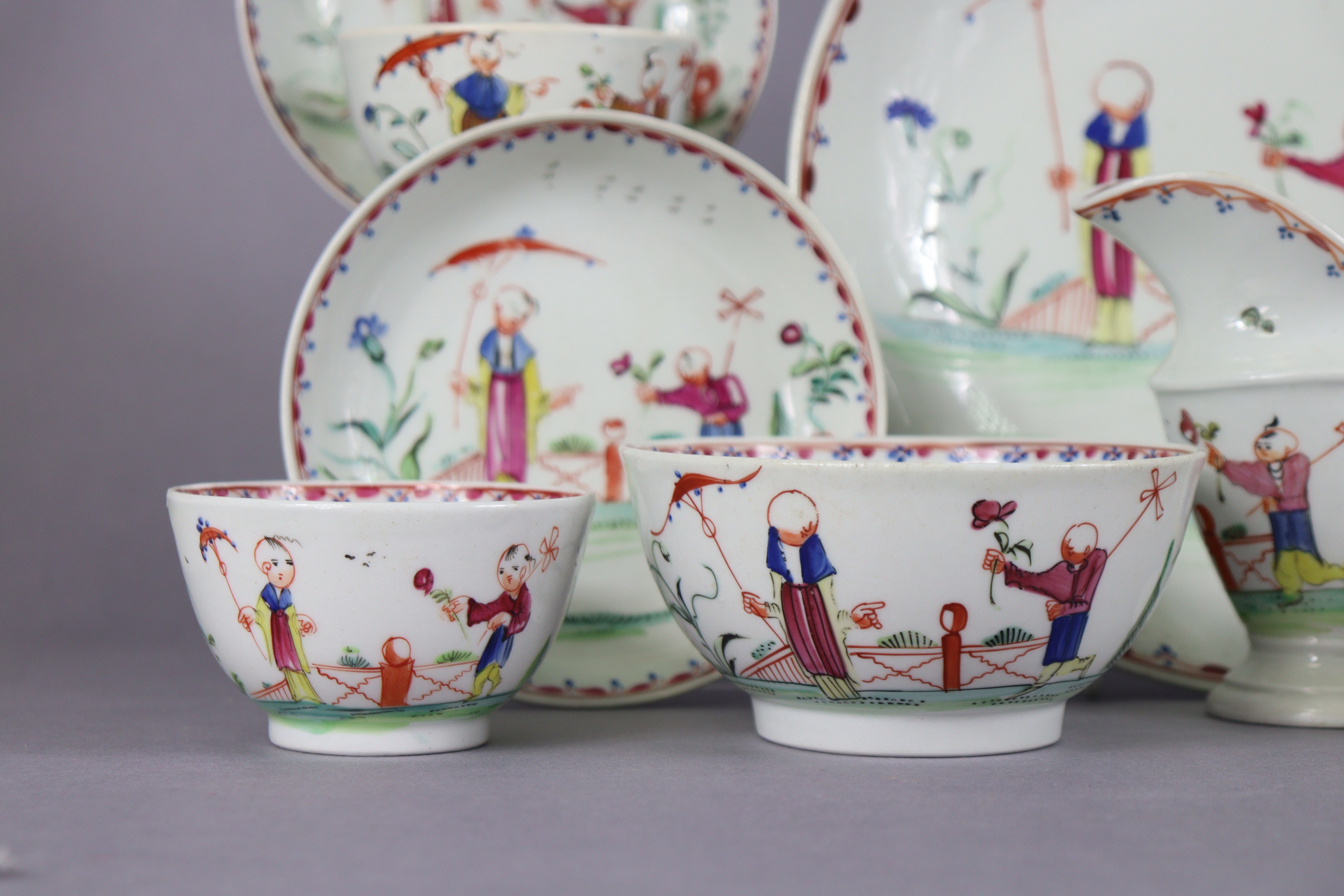 An 18th century Newhall porcelain part tea service, decorated in coloured enamels with chinoiserie - Image 5 of 17