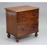 A Victorian bow-front chest commode with hinged lift-lid & turned wooden handles to the mock