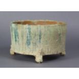 A Chinese provincial earthenware tripod censer with traces of green glaze, incised bands & on three