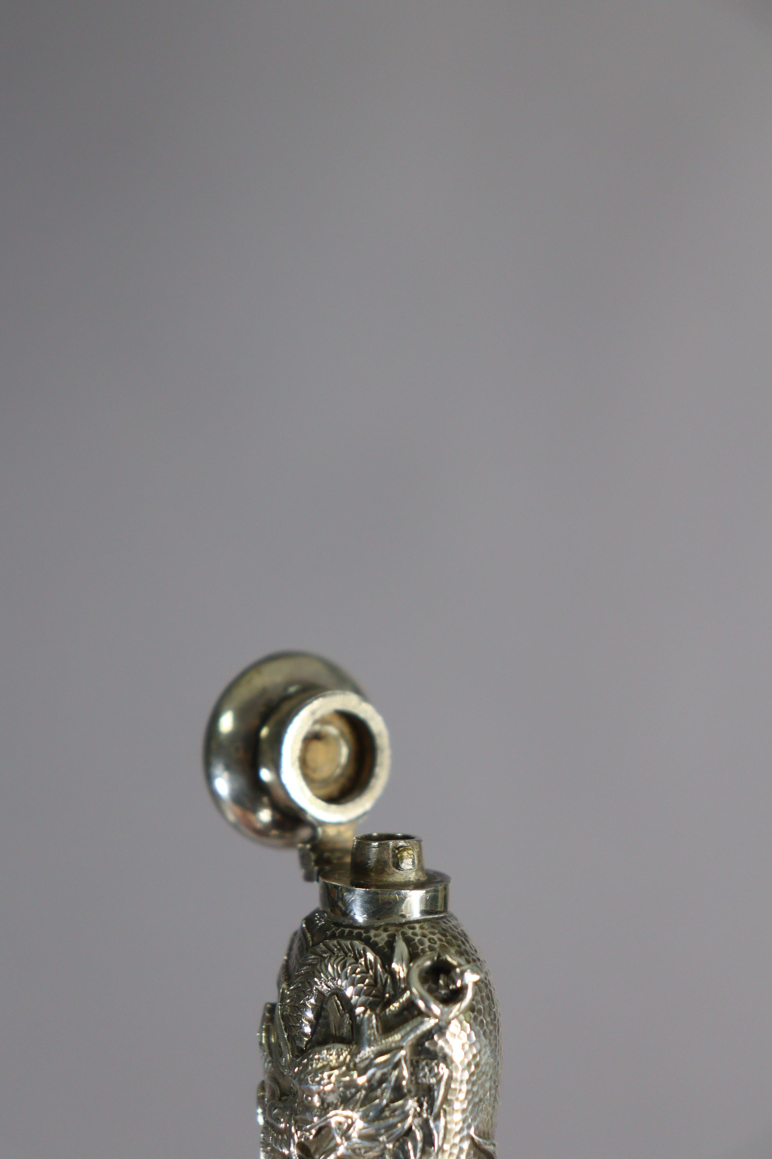 A late 19th century bloodstone cylindrical scent bottle encased in medieval style un-marked white - Image 5 of 10