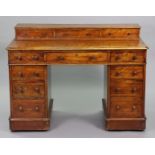 A Victorian satin birch pedestal desk with stage back & inset leather writing surface to the